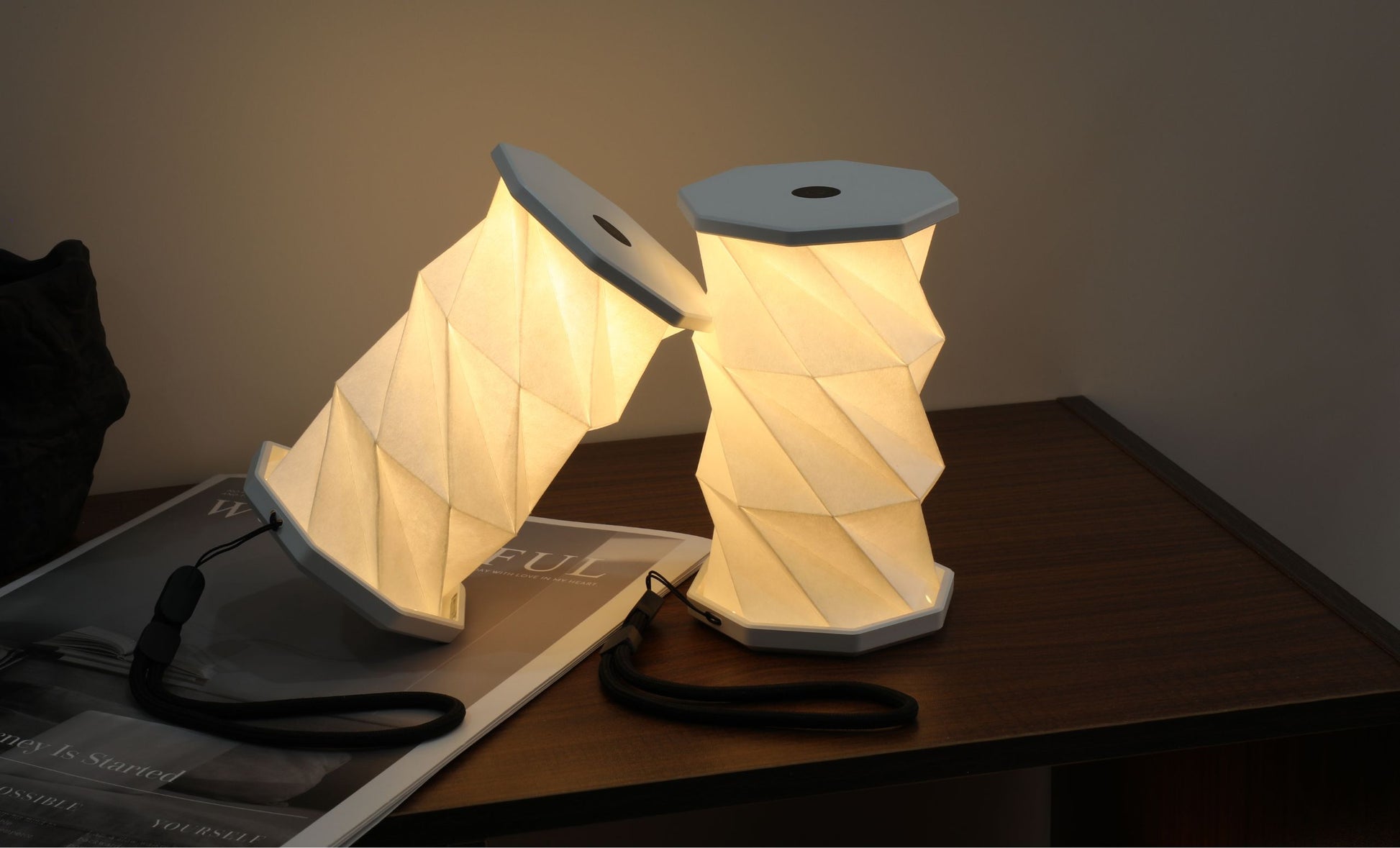 Two lampspools on a table with a warm glow